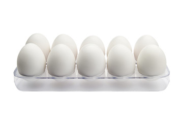 White fresh eggs in a plastic tray isolated on a white background