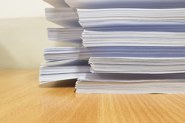 Stacks of white paper,Lined concept design,on desk.