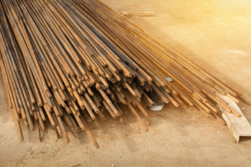 Rusty steel bar or steel reinforcement bar texture in construction site with sunlight