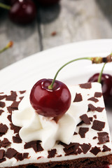 Chocolate cake with cherries and whipped cream. Black Forest cake