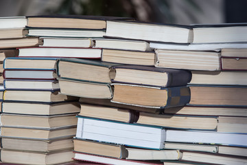 Stack of books is stacked in chaotic manner