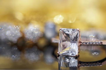 Luxury Jewelry diamond and pink topaz ring with reflection on black background