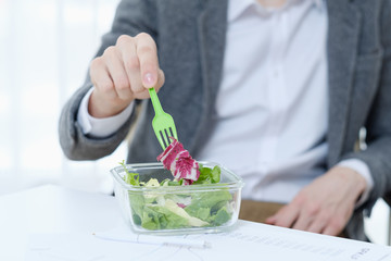 wholesome office worker lifestyle. healthy food. vegan organic diet. low calorie salad lunch.