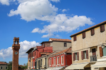 Clock tower with historic buildings in Venice, Italy