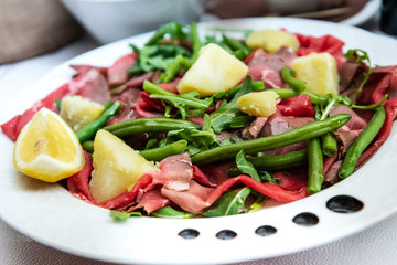 close up of tasty cold meats on the table