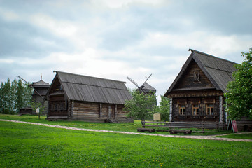 Fototapeta na wymiar Old log houses in the village. Museum of wooden architecture in Suzdal, Russia