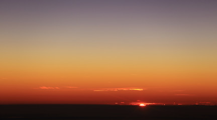 Fototapeta premium Dawn sky, in-flight shot.