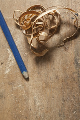 pen and sawdust on wooden board. carpentry