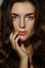 Fototapeta premium Portrait of sexy woman with a beautiful curly hair