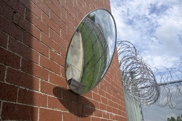 Small exercise yard reflected in security mirror