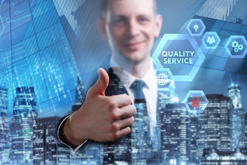 Business, Technology, Internet and network concept. Young businessman working on a virtual screen of the future and sees the inscription: Quality service