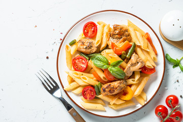 Pasta penne with chiken and vegetables.