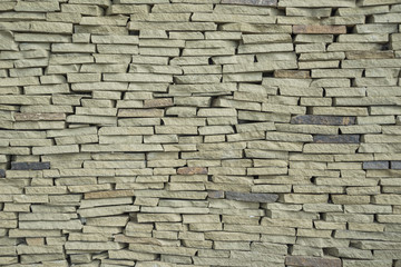 The texture of a wall made of stone slate