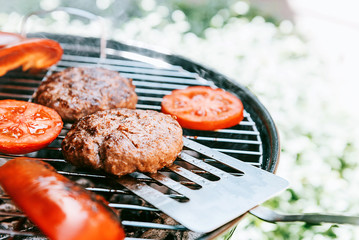 ingredients for burger are grilled