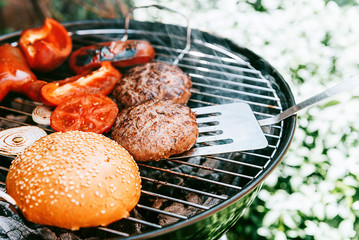 ingredients for burger are grilled