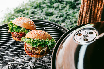 grill with burgers