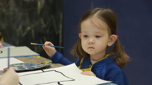 children, the child draw a still life.