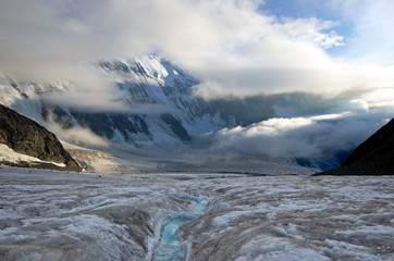 Arbuz glacier with melt water runnel, Altai mountains, Russia