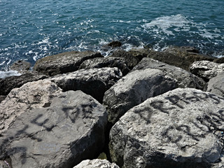 Fototapeta na wymiar Boulders in the azure sea