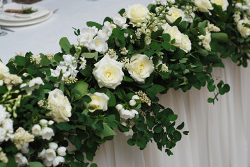 Obraz na płótnie Canvas Beautiful White and Green Flower Decoration Arrangement on Wedding Table. Wedding Bridal Flower Decoration.