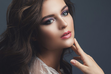 Fototapeta premium Young woman with beautiful make-up and hairstyle