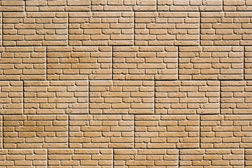 A tile imitating a brickwork of beige color. Textured background