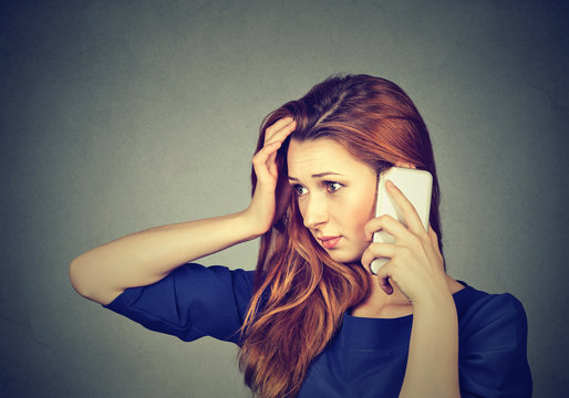 Stressed girl speaking on phone