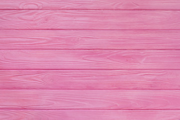 Brushed wood texture with pink color background