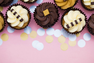 Cupcakes decorated with chocolate,caramel and vanilla icing
