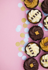 Cupcakes decorated with chocolate,caramel and vanilla icing