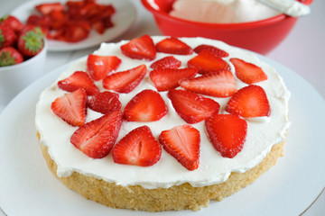 Making cake with strawberry and cream background. Top view. Cooking ingredients. Mockup for menu, recipe or culinary classes.