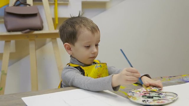 children, the child draw a still life.