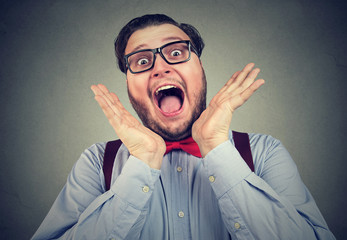Eccentric happy man screaming at camera