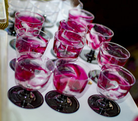 Glasses marked with strawberry syrup for filling