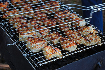 Chicken meat is grilled on the nature.
