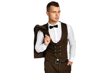 Man in tuxedo and vest in white shirt on white background