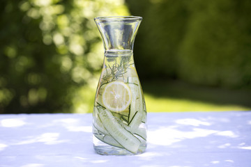 Detox water, fresh lemonade with ice, lemon, cucumber and rosemary