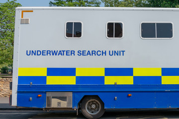 Underwater search unit mobile police scuba diving team parked at roadside whilst searching for a...