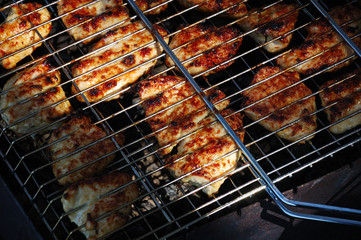 Chicken meat is grilled on the nature.
