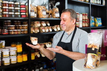 man standing near counter