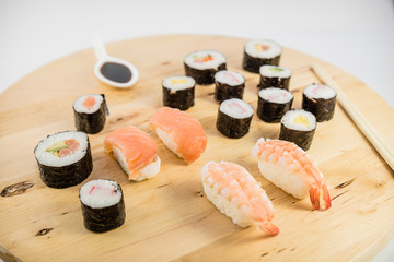 japanese food type sushi on wooden table with white background