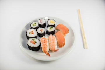 Japanese food Sushi on white plate with japanese chopsticks on white background