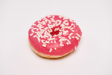 Appetizing donut with sprinkles isolated on white background.
