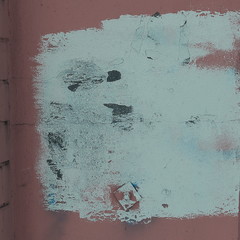 close up.white paint smeared on the Burgundy floor floor