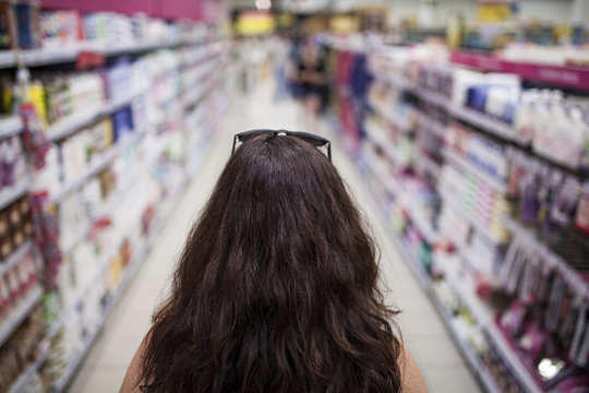 Woman From Behind In Supermarket Aisle