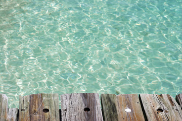 A sparse composition of turquoise water useful for design elements.