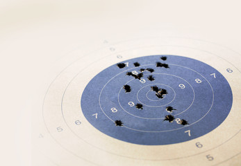 Target with real bullet hole, Focused on the center of the target, Selective focus