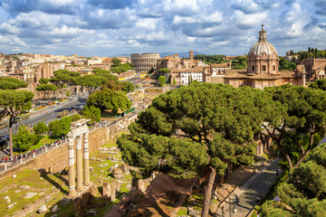 Fototapeta premium Aerial scenic view of Colosseum, Roman Forum and church of Santi Luca e Martinain in Rome, Italy. Rome architecture and landmark.rchitecture and landmark.