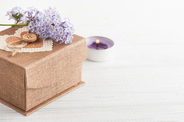 Lilac flowers with gift box