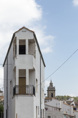 Fototapeta na wymiar the house and the church in the background, Ain, Castellon, Spain